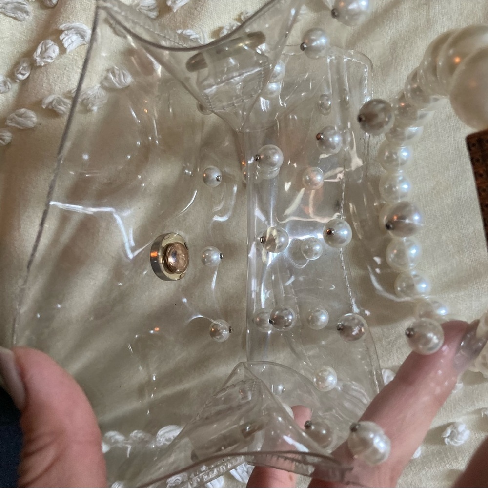 Trifled clear pearl bag